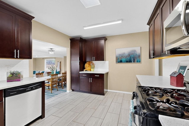 3801 Simms Ave SE, Albuquerque, NM 87108 - kitchen with appliances with stainless steel finishes, decorative backsplash, light countertops, and dark brown cabinetry