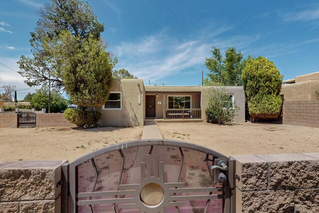 3801 Simms Ave SE, Albuquerque, NM 87108 - southwest-style home featuring a gate and stucco siding