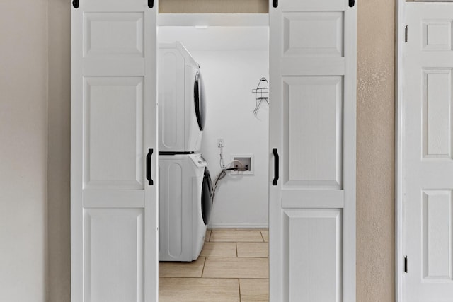 3801 Simms Ave SE, Albuquerque, NM 87108 - washroom with estacked washer and dryer and baseboards