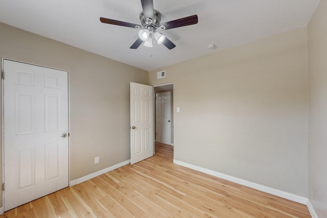 3801 Simms Ave SE, Albuquerque, NM 87108 - unfurnished bedroom featuring light wood finished floors and a ceiling fan