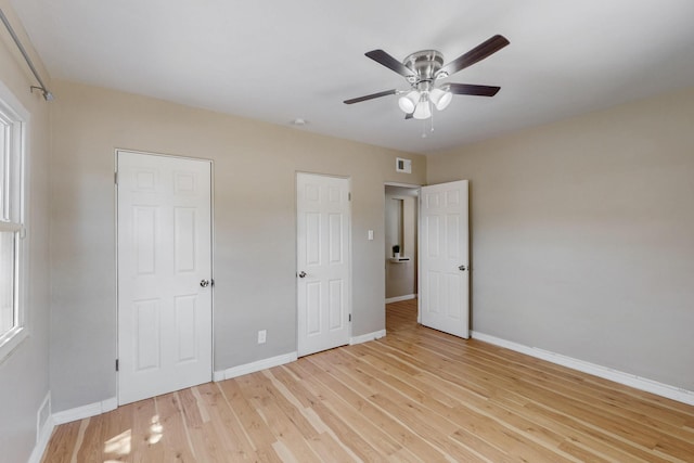 3801 Simms Ave SE, Albuquerque, NM 87108 - unfurnished bedroom with light wood-style flooring and ceiling fan