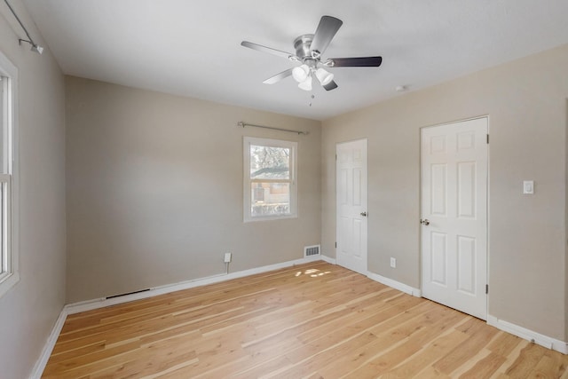 3801 Simms Ave SE, Albuquerque, NM 87108 - unfurnished bedroom with light wood-style flooring and ceiling fan