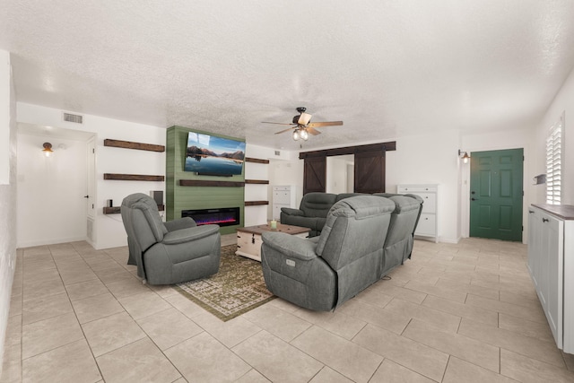 3758 Cattle Dr NE, Rio Rancho, NM 87144 - living room with a ceiling fan, a fireplace, light tile patterned flooring, and a textured ceiling