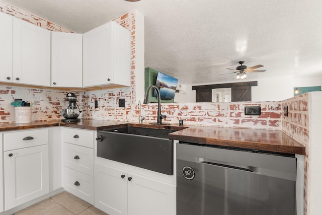 3758 Cattle Dr NE, Rio Rancho, NM 87144 - kitchen with stainless steel dishwasher, a textured ceiling, a ceiling fan, white cabinets, and light tile patterned flooring