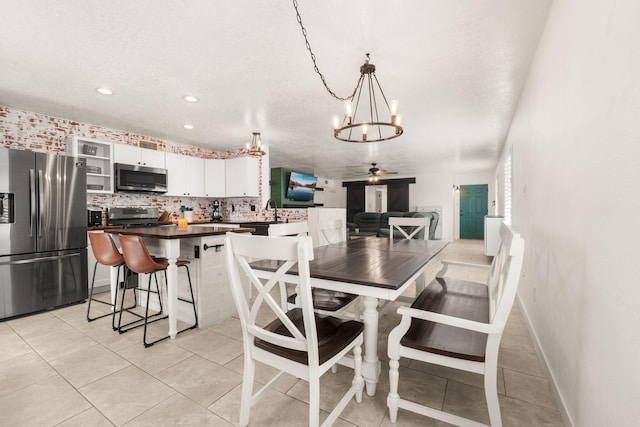 3758 Cattle Dr NE, Rio Rancho, NM 87144 - dining room featuring a chandelier, ceiling fan, light tile patterned floors, and recessed lighting