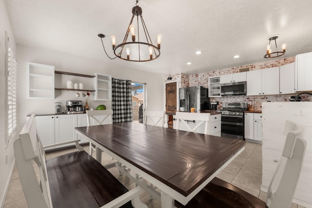 3758 Cattle Dr NE, Rio Rancho, NM 87144 - dining room with a chandelier, light tile patterned floors, recessed lighting, and a textured ceiling