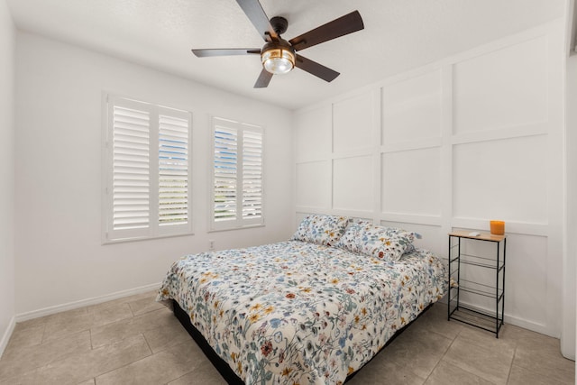 3758 Cattle Dr NE, Rio Rancho, NM 87144 - bedroom with a decorative wall, light tile patterned floors, and ceiling fan