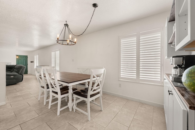 3758 Cattle Dr NE, Rio Rancho, NM 87144 - dining space with a chandelier and baseboards
