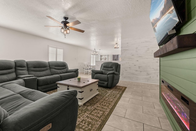 3758 Cattle Dr NE, Rio Rancho, NM 87144 - living room with ceiling fan, light tile patterned floors, a textured ceiling, and a chandelier