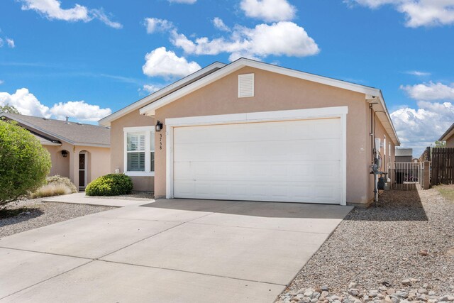 3758 Cattle Dr NE, Rio Rancho, NM 87144 - ranch-style house with stucco siding, driveway, and a garage
