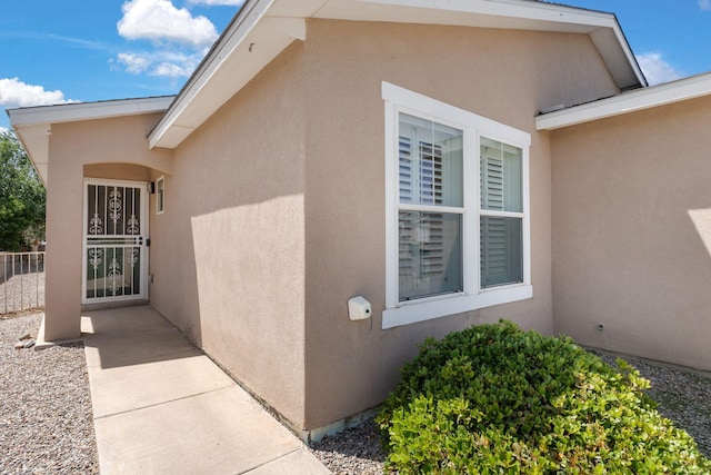 3758 Cattle Dr NE, Rio Rancho, NM 87144 - view of exterior entry with stucco siding