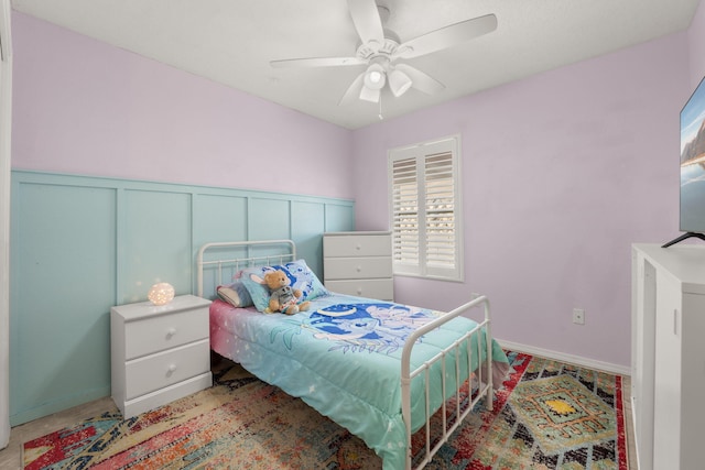 3758 Cattle Dr NE, Rio Rancho, NM 87144 - bedroom featuring a wainscoted wall, ceiling fan, and a decorative wall
