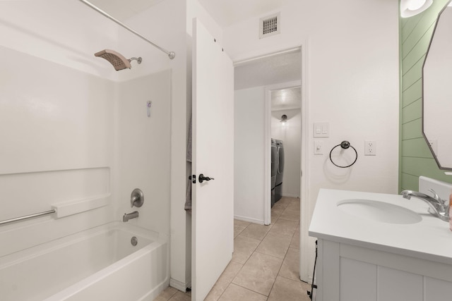 3758 Cattle Dr NE, Rio Rancho, NM 87144 - full bath with bathing tub / shower combination, tile patterned flooring, vanity, and washer / clothes dryer