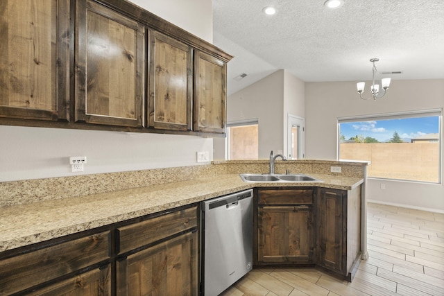 2170 Firewheel Ave SW, Los Lunas, NM 87031 - kitchen featuring stainless steel dishwasher, a peninsula, a chandelier, dark brown cabinets, and a textured ceiling