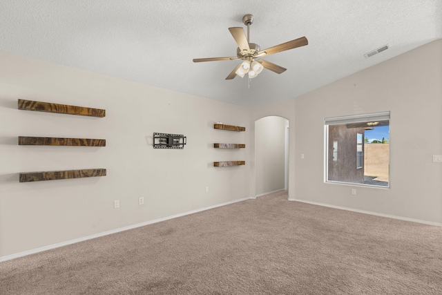2170 Firewheel Ave SW, Los Lunas, NM 87031 - carpeted spare room with ceiling fan, arched walkways, a textured ceiling, and vaulted ceiling