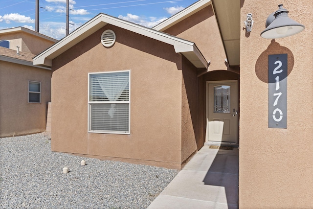 2170 Firewheel Ave SW, Los Lunas, NM 87031 - view of exterior entry with stucco siding