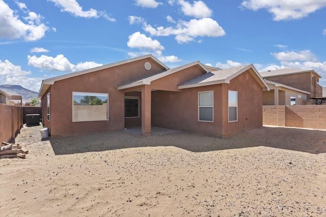 2170 Firewheel Ave SW, Los Lunas, NM 87031 - rear view of property featuring stucco siding, a fenced backyard, and a patio