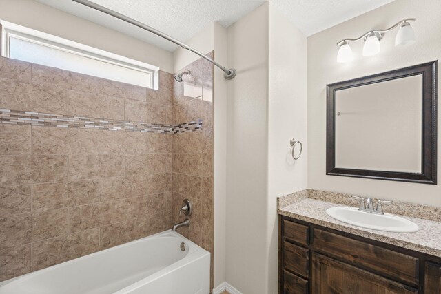 2170 Firewheel Ave SW, Los Lunas, NM 87031 - bathroom featuring vanity, shower / tub combination, and a textured ceiling
