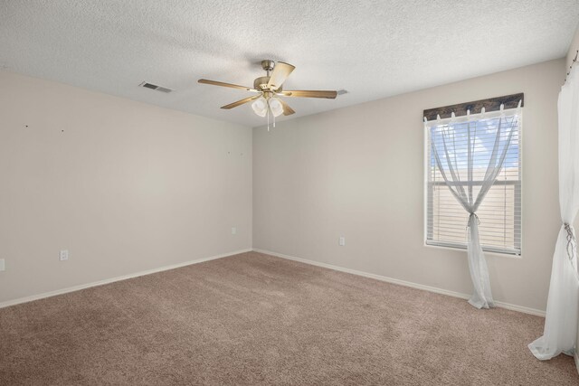 2170 Firewheel Ave SW, Los Lunas, NM 87031 - spare room featuring a ceiling fan, carpet, and a textured ceiling