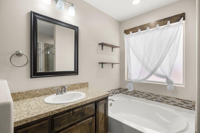2170 Firewheel Ave SW, Los Lunas, NM 87031 - bathroom featuring vanity and a garden tub