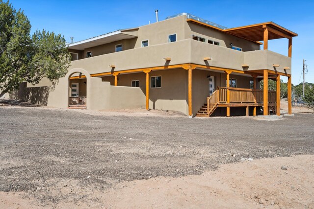 30A Arroyo Coyote Rd, Santa Fe, NM 87508 - rear view of house featuring stucco siding