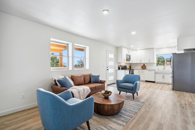 30A Arroyo Coyote Rd, Santa Fe, NM 87508 - living room with light wood-style flooring and recessed lighting