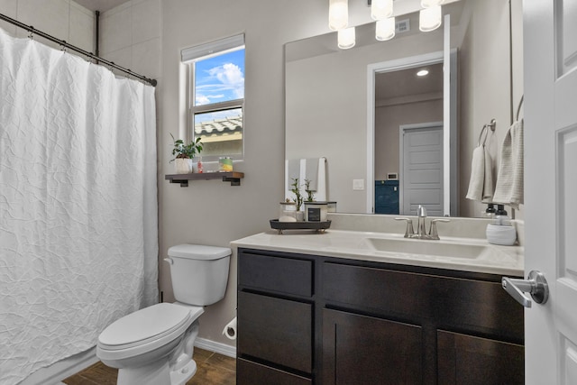 9035 S Sky St NW, Albuquerque, NM 87114 - bathroom with toilet, wood finished floors, vanity, a shower with curtain, and baseboards