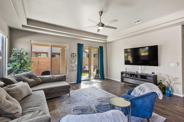 9035 S Sky St NW, Albuquerque, NM 87114 - living room featuring ceiling fan, wood finished floors, a tray ceiling, and baseboards