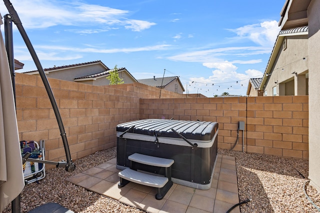 9035 S Sky St NW, Albuquerque, NM 87114 - fenced backyard featuring a hot tub and a patio