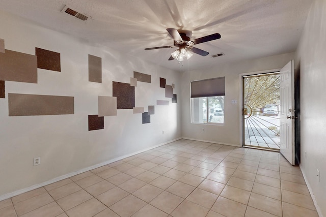 2815 Quail Pointe Dr NW, Albuquerque, NM 87120 - unfurnished room featuring light tile patterned floors, a ceiling fan, and baseboards