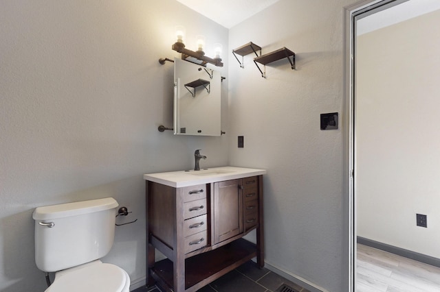 2815 Quail Pointe Dr NW, Albuquerque, NM 87120 - bathroom with vanity, toilet, and baseboards