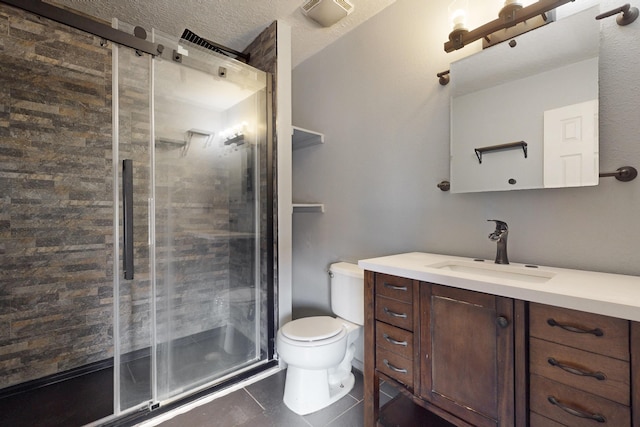 2815 Quail Pointe Dr NW, Albuquerque, NM 87120 - bathroom featuring vanity, a shower stall, toilet, tile patterned flooring, and a textured ceiling