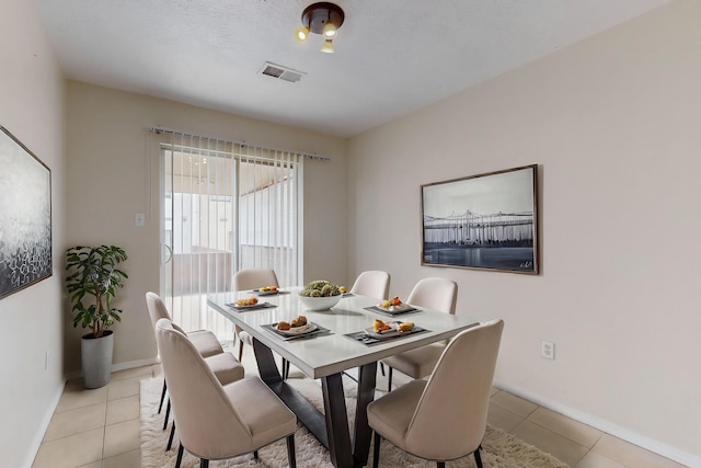 2815 Quail Pointe Dr NW, Albuquerque, NM 87120 - dining room with light tile patterned floors and baseboards