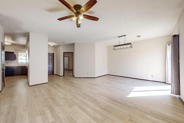 1375 Golden Eye Loop NE, Rio Rancho, NM 87144 - unfurnished living room featuring light wood finished floors, ceiling fan, and baseboards