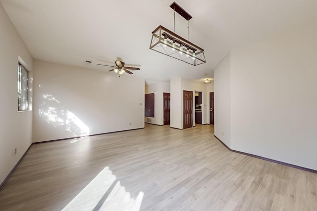 1375 Golden Eye Loop NE, Rio Rancho, NM 87144 - unfurnished room featuring light wood-style floors, baseboards, and a ceiling fan