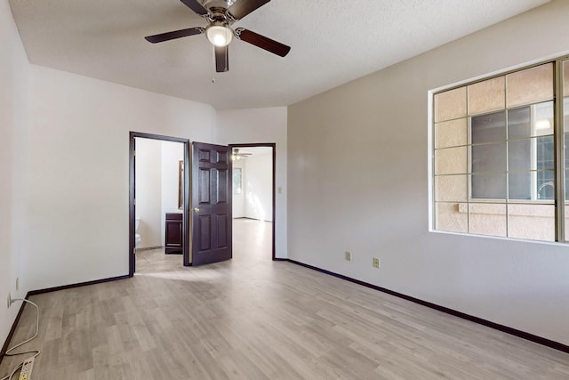 1375 Golden Eye Loop NE, Rio Rancho, NM 87144 - empty room with a ceiling fan, light wood finished floors, and baseboards