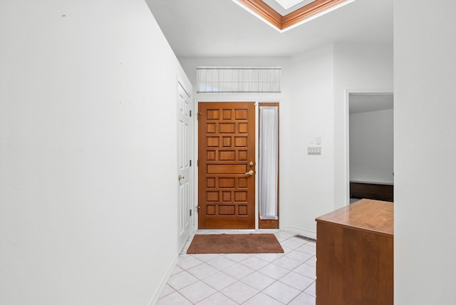 7913 Woodridge Dr NE, Albuquerque, NM 87109 - foyer entrance featuring light tile patterned flooring, baseboards, and a skylight