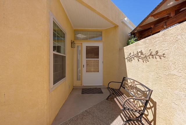 7913 Woodridge Dr NE, Albuquerque, NM 87109 - doorway to property with stucco siding