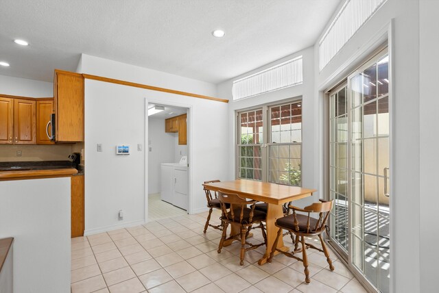 7913 Woodridge Dr NE, Albuquerque, NM 87109 - dining space featuring washer and dryer, recessed lighting, and baseboards