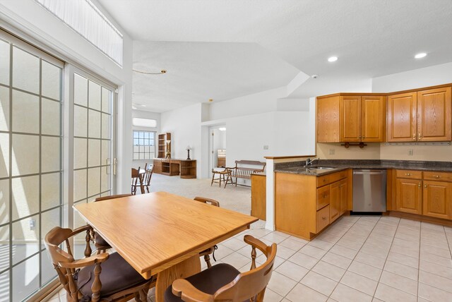 7913 Woodridge Dr NE, Albuquerque, NM 87109 - kitchen with stainless steel dishwasher, a sink, recessed lighting, light tile patterned floors, and brown cabinetry
