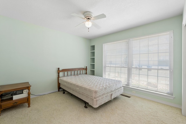 7913 Woodridge Dr NE, Albuquerque, NM 87109 - bedroom featuring carpet flooring, baseboards, and a ceiling fan