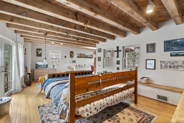 4 Pop Chalee, Glorieta, NM 87535 - bedroom with light wood-style flooring, multiple windows, wood ceiling with exposed beams, and access to outside
