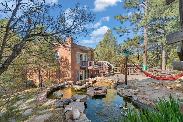 4 Pop Chalee, Glorieta, NM 87535 - view of yard featuring a garden pond, a deck, and stairs