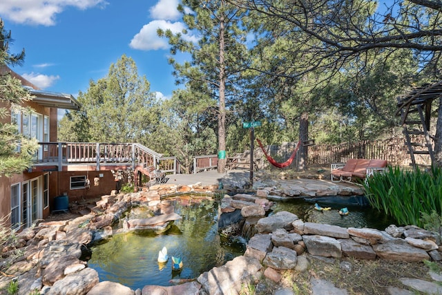 4 Pop Chalee, Glorieta, NM 87535 - view of yard featuring a garden pond, a wooden deck, and stairs