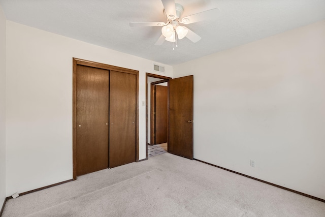 7401 Volunteer St NE, Albuquerque, NM 87109 - unfurnished bedroom with light colored carpet, a closet, a ceiling fan, and baseboards