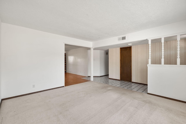 7401 Volunteer St NE, Albuquerque, NM 87109 - carpeted empty room featuring a textured ceiling and baseboards