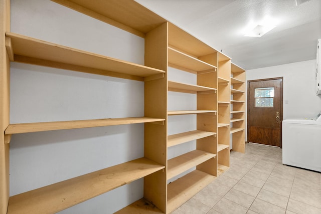 7401 Volunteer St NE, Albuquerque, NM 87109 - walk in closet featuring washer / dryer and light tile patterned floors