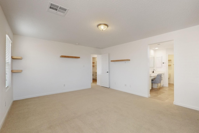 3034 Shannon Ln NE, Rio Rancho, NM 87144 - unfurnished bedroom featuring light colored carpet, baseboards, and ensuite bathroom