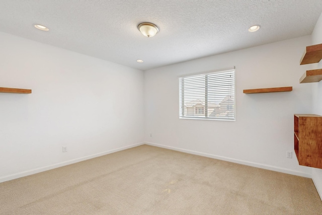 3034 Shannon Ln NE, Rio Rancho, NM 87144 - unfurnished room with light colored carpet, baseboards, and recessed lighting