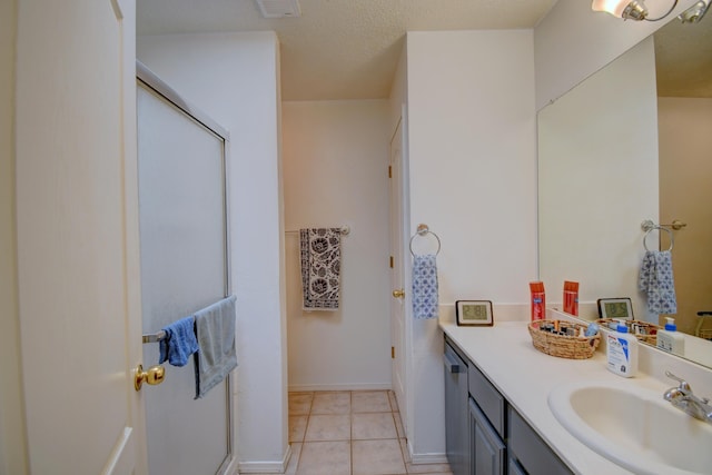 2575 Diamond Peak Dr NE, Rio Rancho, NM 87144 - full bath with vanity, a stall shower, tile patterned flooring, and baseboards
